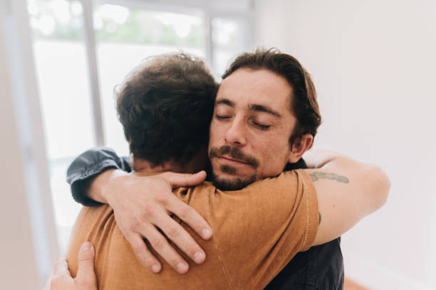 istock Father and son embracing at home 1629591981