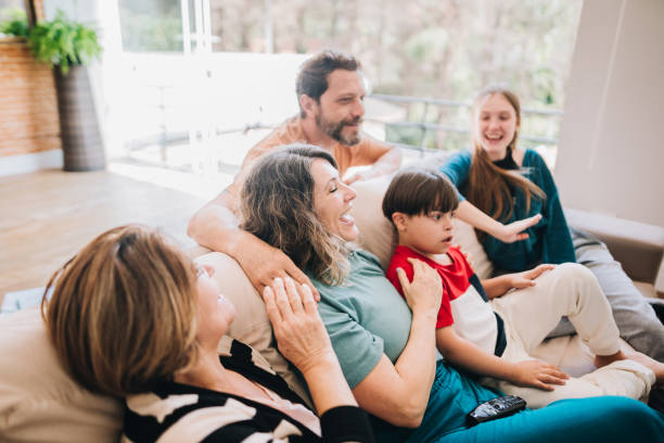 istock Family watching TV at home 1629592134