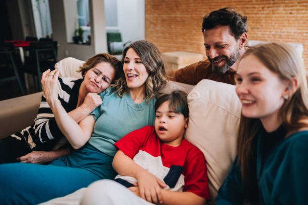 istock Family watching TV at home 1629592150