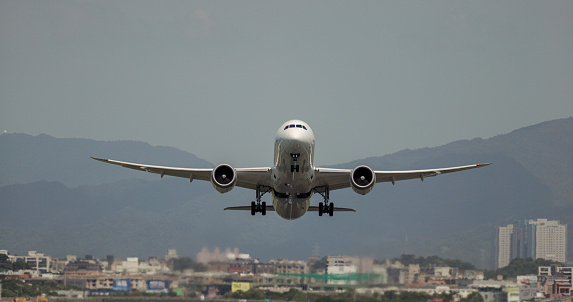 Passenger airplane to take off from the runway and flew overhead