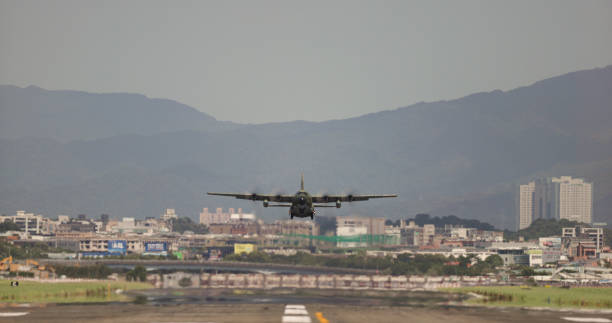 The military transport plane take off on the airport runway