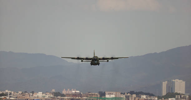 The military transport plane take off on the airport runway