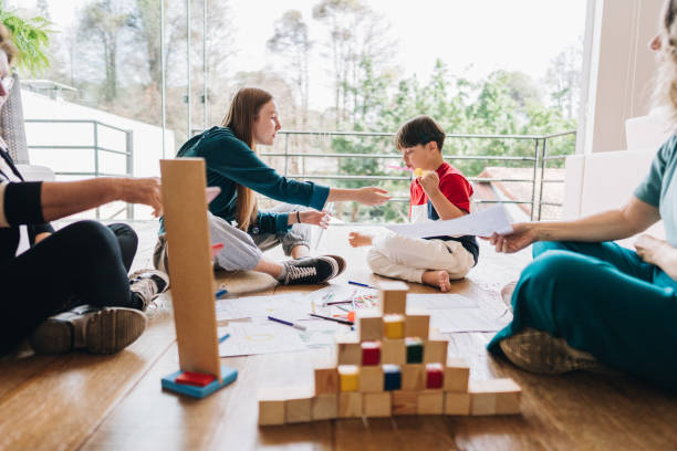 istock Family playing games and drawing at home 1629606931