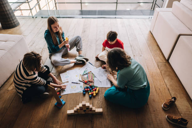 Family playing games and drawing at home