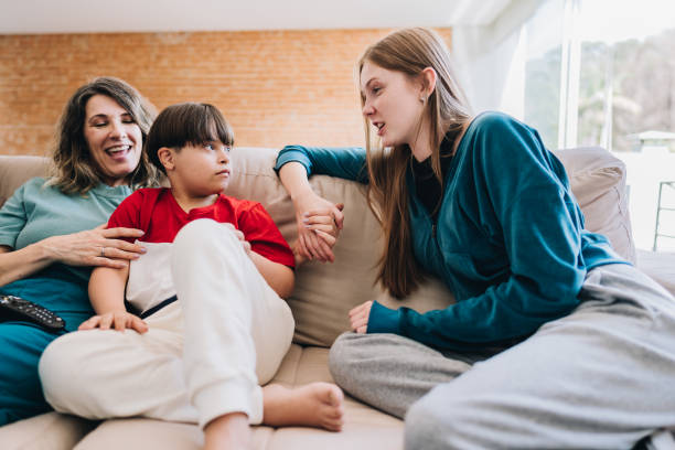 istock Happy family relaxing on sofa and talking at home 1629608565