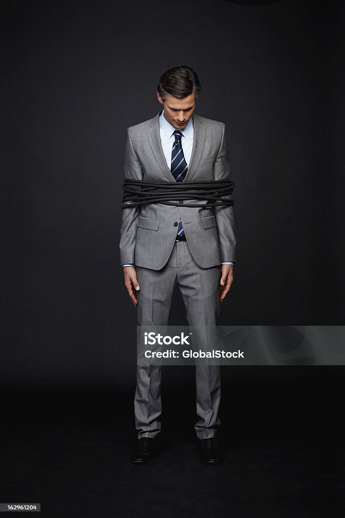 Executive guardando vergognoso - Foto stock royalty-free di Abbigliamento elegante