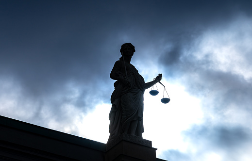 Low angle view of silhouette of justice sculpture , Germany Brandenburg Potsdam