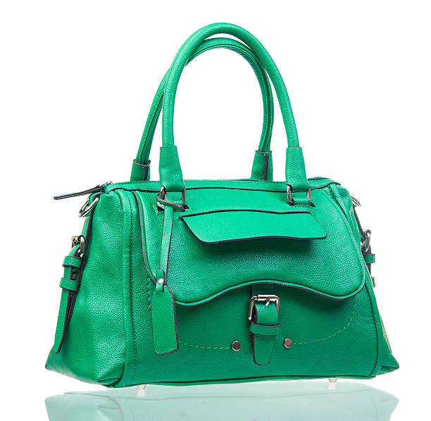 istock Green female handbag over white 162961788