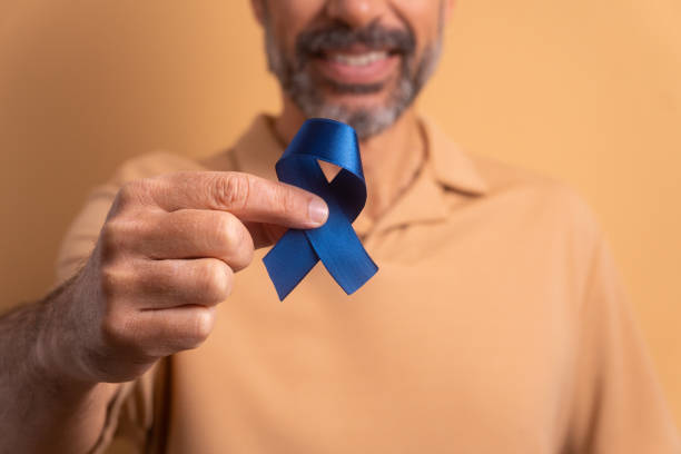 istock hands of showing blue ribbon 1629638310