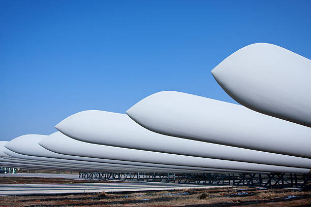 Wind turbine blades Giant wind turbine awaiting assembly at wind farm.  blade stock pictures, royalty-free photos & images