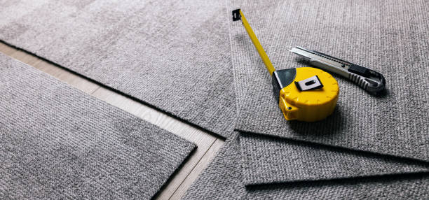 istock carpet tile installation. flooring material. banner with copy space 1629645399