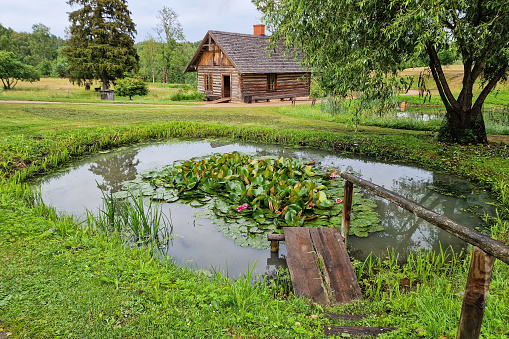 Old sauna and pond in Turaida, Latvia.
