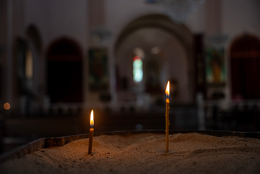 A burning candle at the church, batumi city