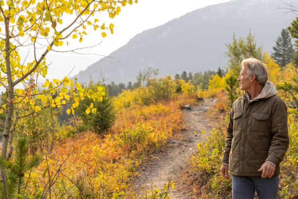 istock Senior man explores meadow in autumn 1629670877