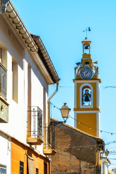 istock Beautiful bell tower and church painted on yellow 1629679053