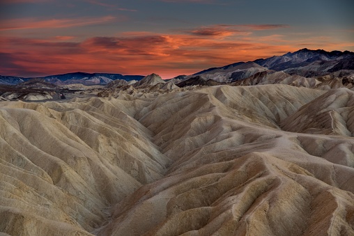 A scenic landscape featuring a sunset sky over Colorado Great Sand Dune National Park