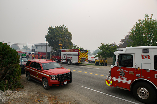 WEST KELOWNA, BC - August 21: Firefighters from 51 communities throughout British Columbia gather for a morning briefing at the firehall in City of West Kelowna, B.C. during the McDougall Creek Wildifre.