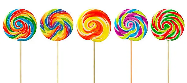 Row of colorful lollipops against white