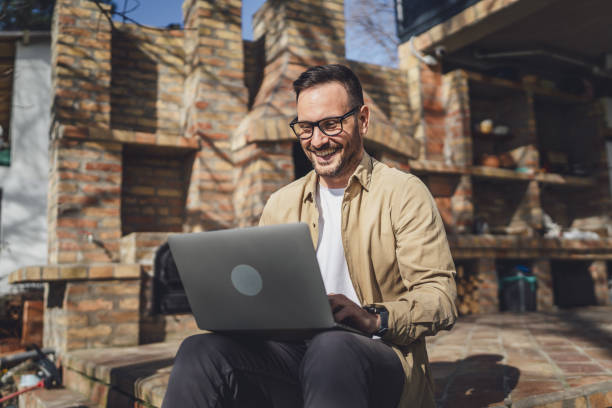istock man caucasian work on laptop computer on terrace happy smile success 1629689483