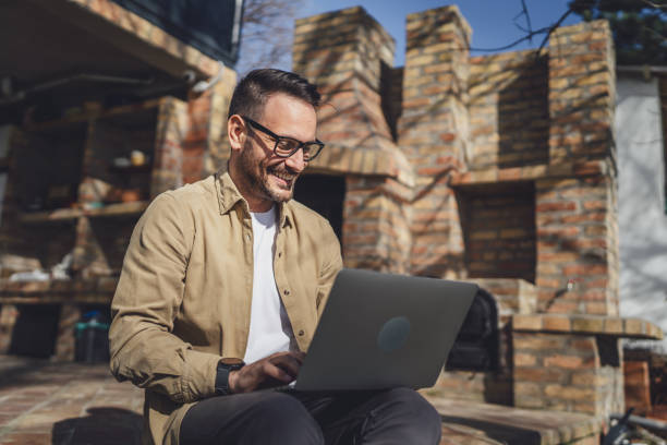 istock man caucasian work on laptop computer on terrace happy smile success 1629690030