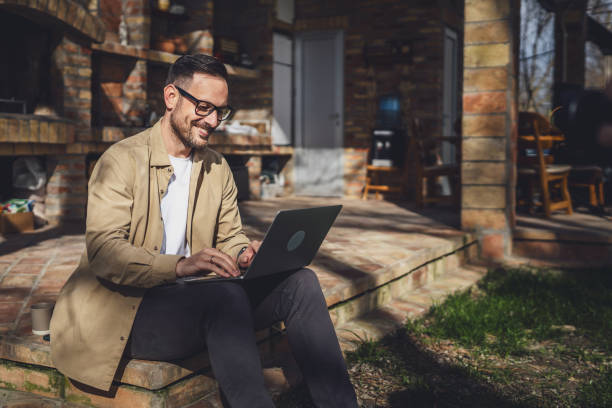 istock man caucasian work on laptop computer on terrace happy smile success 1629690574
