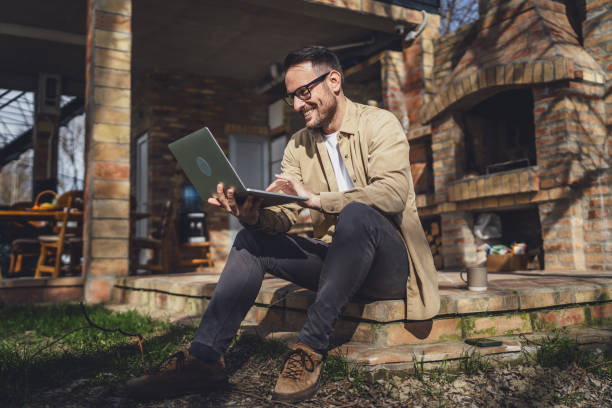 istock man caucasian work on laptop computer on terrace happy smile success 1629690577