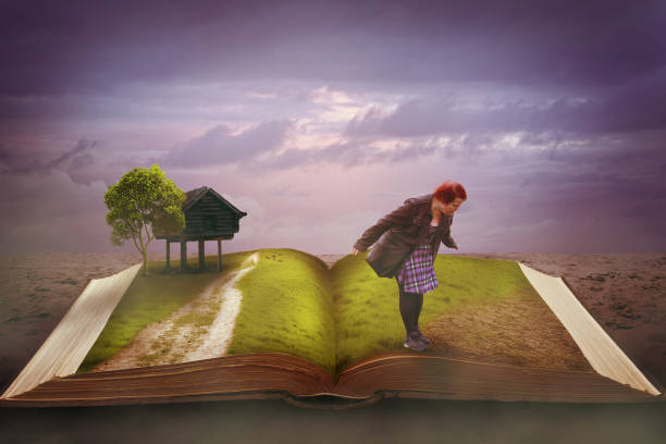 istock Woman standing on field in a book 1629692138