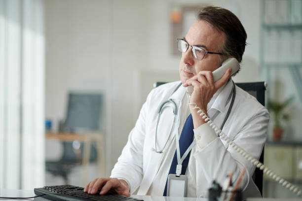 istock Doctor Answering Phone Call 1629692743