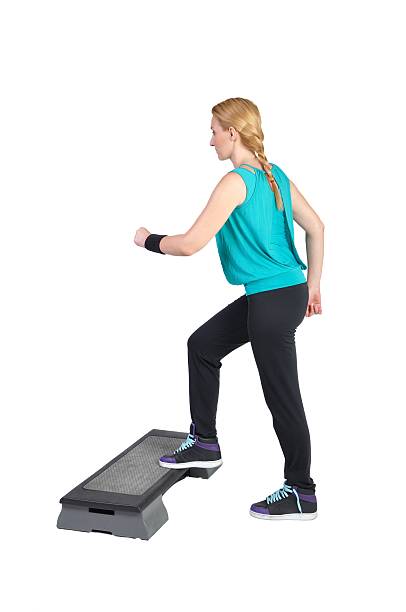 istock Fit young female aerobic instructor showing different exercises 162975762