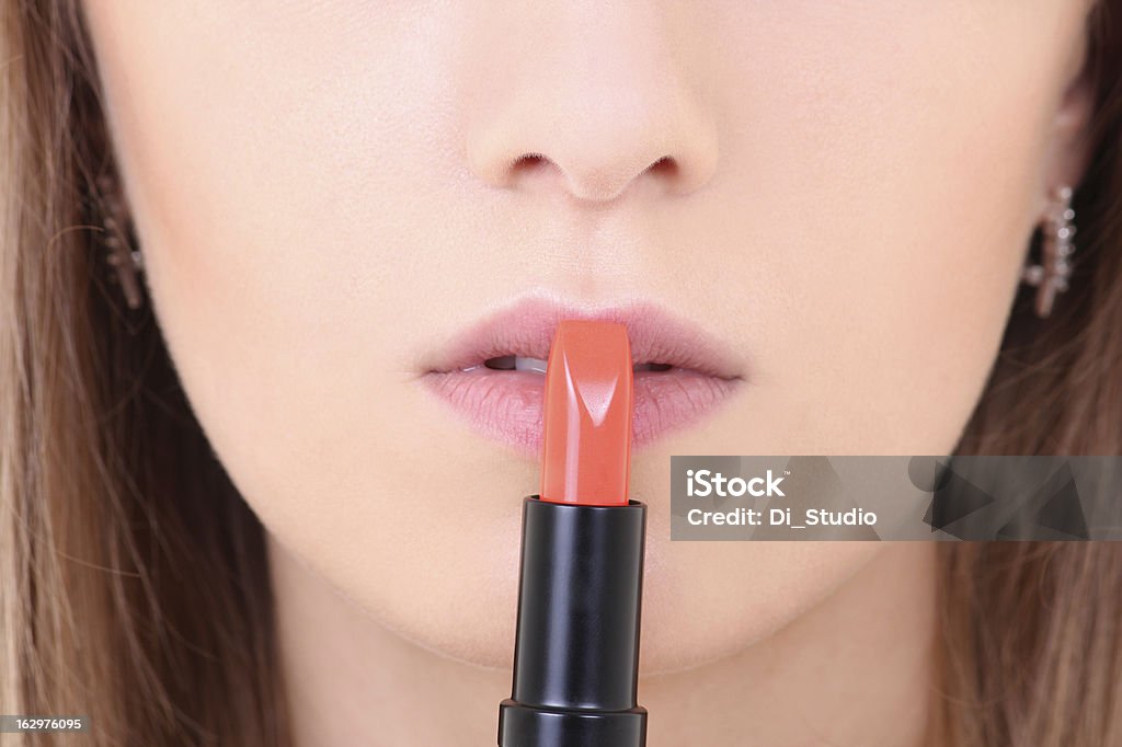 Hembra labios con pintalabios naranja - Foto de stock de Adulto libre de derechos