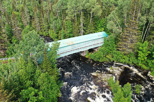 An aerial view of Lac Ha! Ha! Covered Bridge in Quebec, Canada