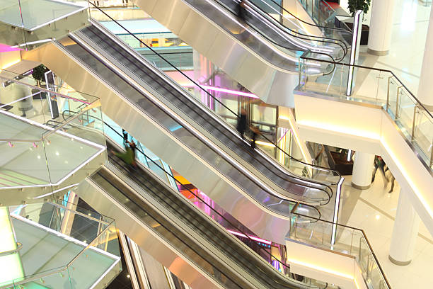 istock mall with escalators and people in motion 162979527