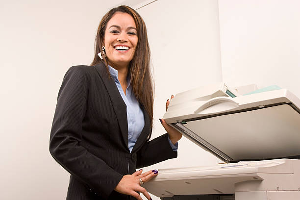 istock Pretty businesswoman making copies 162980705