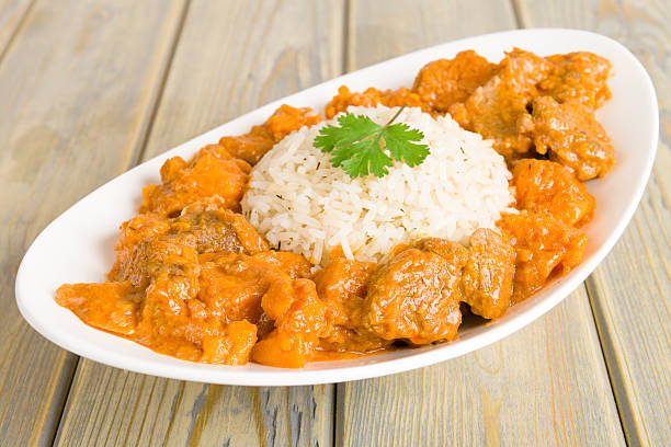 Caribbean Lamb and Sweet Potato Curry Lamb and sweet potato peanut stew served with white rice. Caribbean and West African traditional dish. antilles stock pictures, royalty-free photos & images