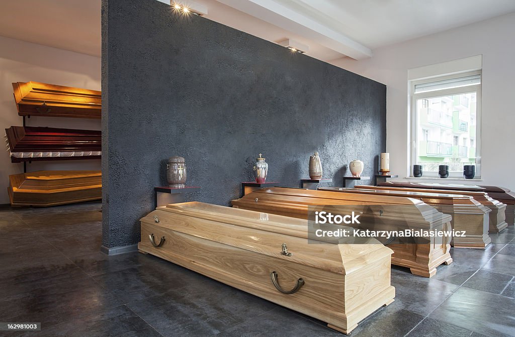 Funeral home with wooden coffin Coffins standing in funeral house Funeral Parlor Stock Photo