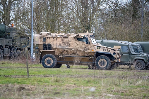 Salisbury, United Kingdom – March 08, 2023: A British foxhound-protected patrol stands alert and ready for duty