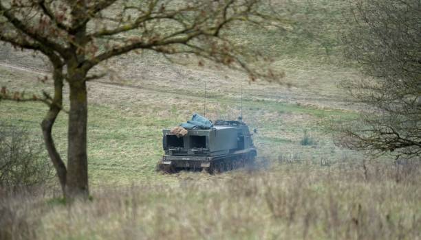 army mlrs in action situated on a grassy field in the outdoor environment - mlrs imagens e fotografias de stock