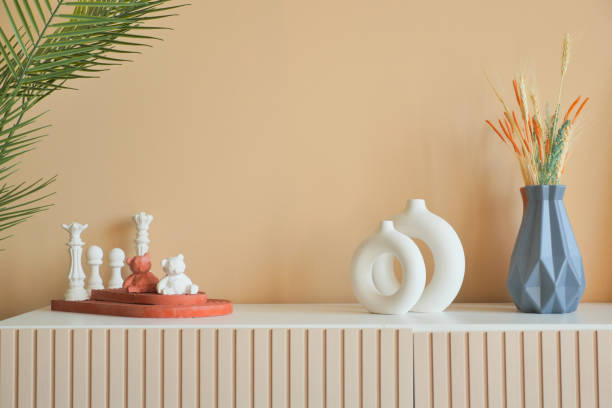 istock home interior decoration against light orange color wall . 1629820001
