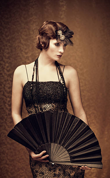istock woman holding a fan - vintage style 162984368