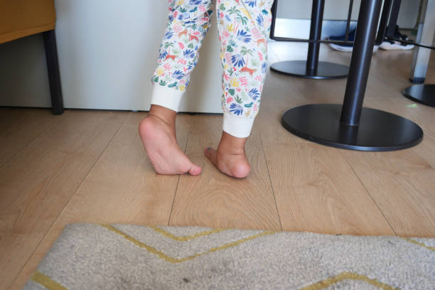 istock low angle view of A child walking on tiptoes 1629867222