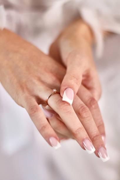 istock The bride puts a wedding ring on her finger. Preparation for the wedding. 1629868359