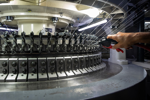 The maintenance of the machines in the thread factory