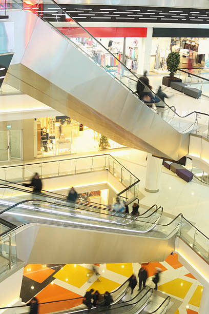 istock mall with escalators and people in motion 162988204