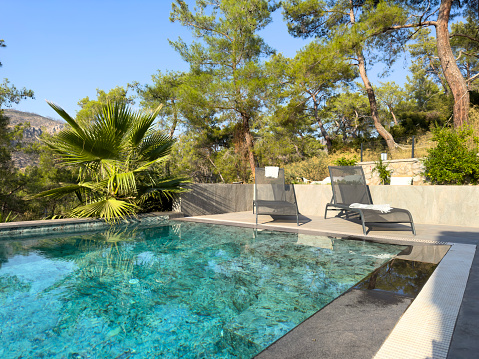 Section of swimming pool with stone surround