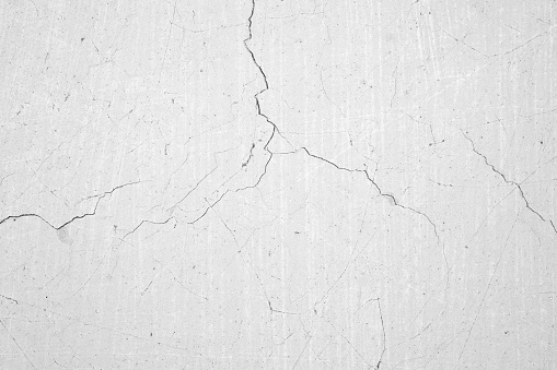 Cracks in an old concrete wall.