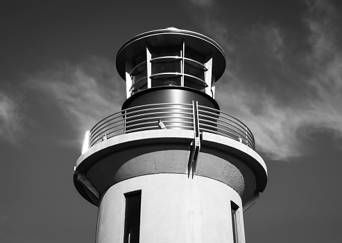 Black and white photo of lighthouse on clear day