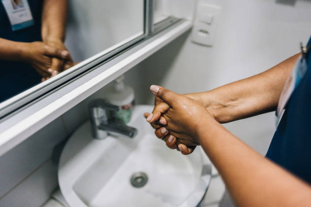 istock Nurse washing hands in the bathroom 1629901086