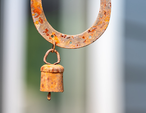 Rusted horseshoe and rusted bell