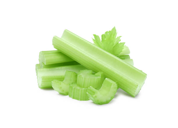 istock Fresh cut celery stalks and leaf isolated on white 1629921153
