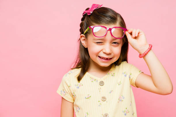 istock Happy kid winking and enjoying having fun with glasses 1629930906